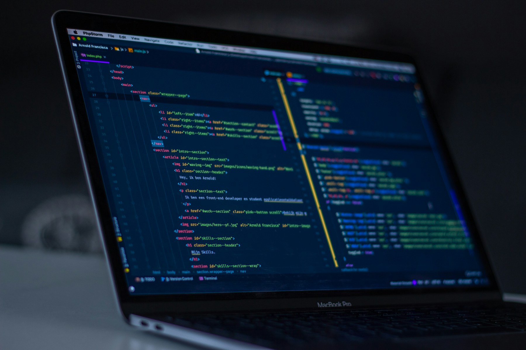 Web development code open on a real laptop